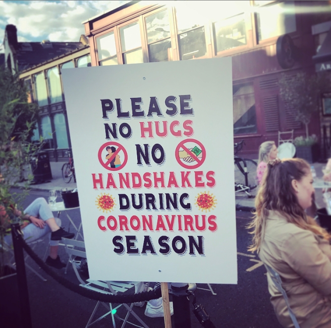 Sign: Please no hugs no handshakes during coronavirus season